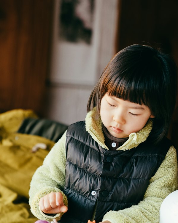 Young girl in a puffer vest