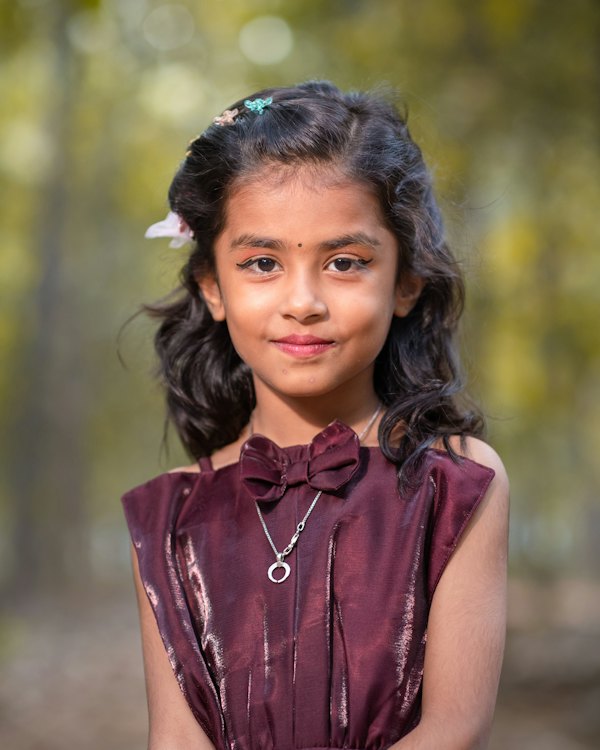 Smiling girl in a maroon dress